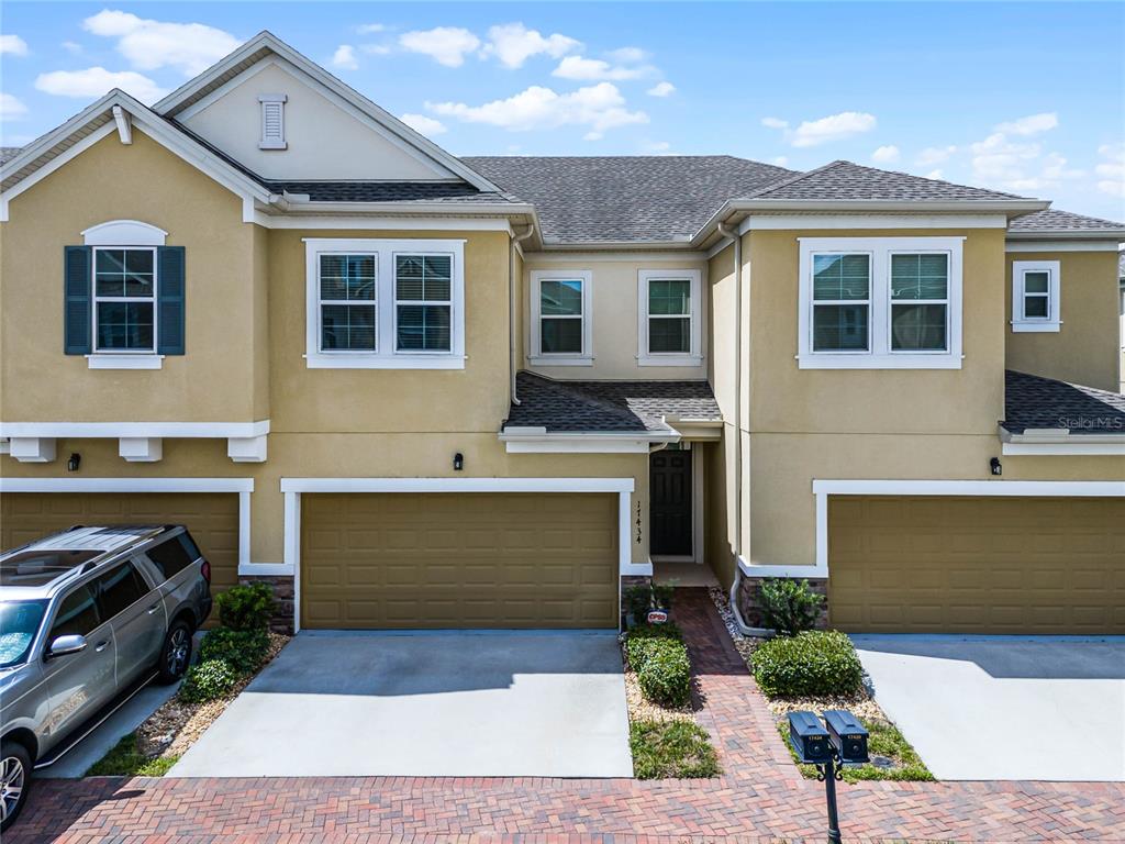 a front view of a house with a garage