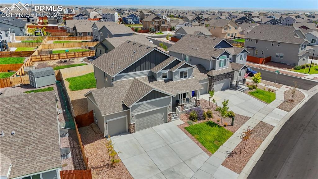 an aerial view of a house with a garden