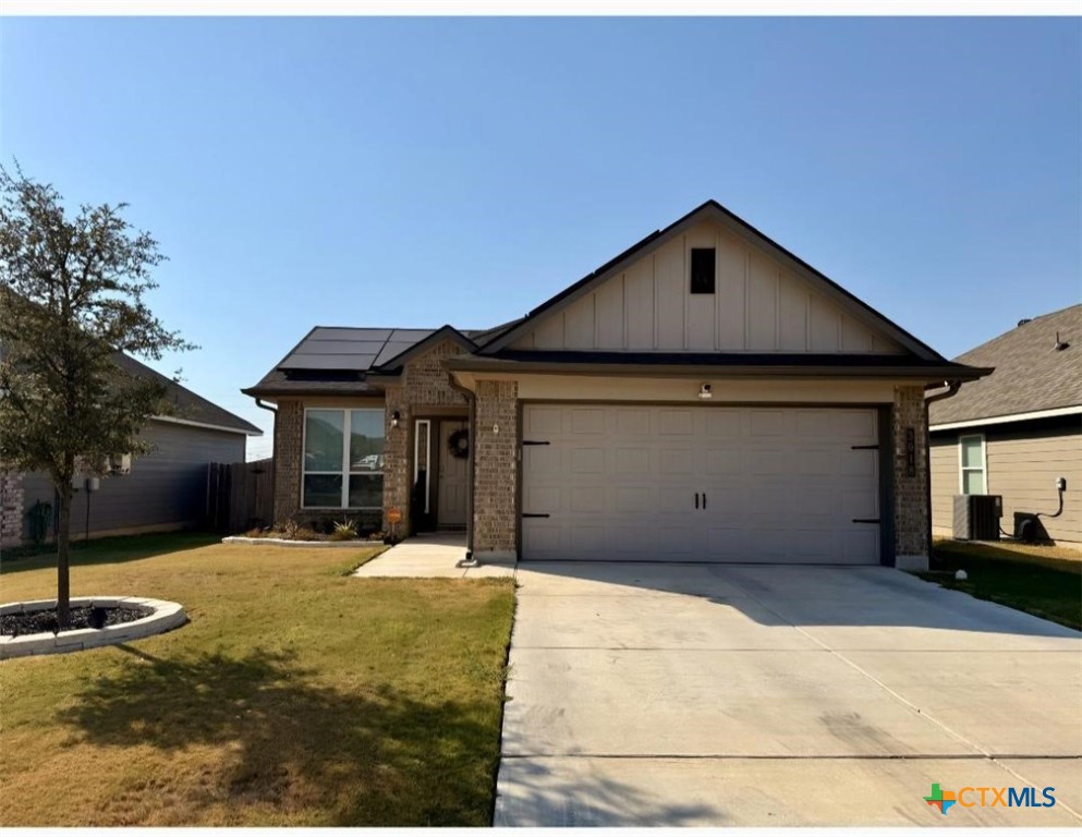 a front view of a house with yard