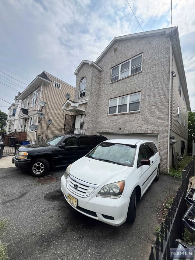 a view of a car in front of a house