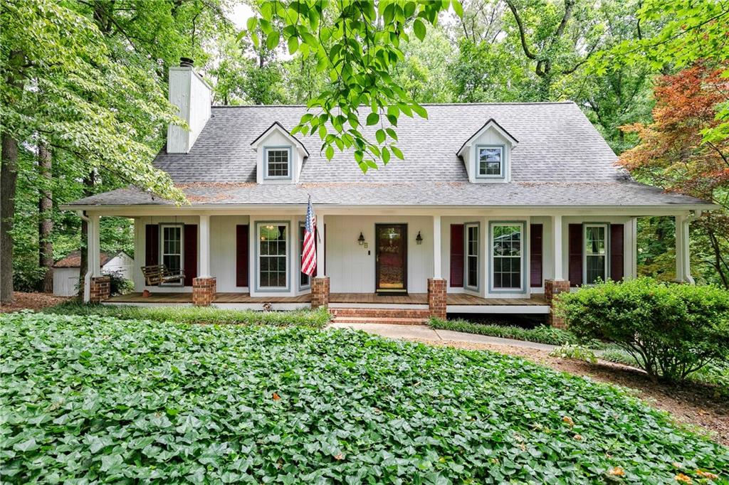 front view of a house with a garden