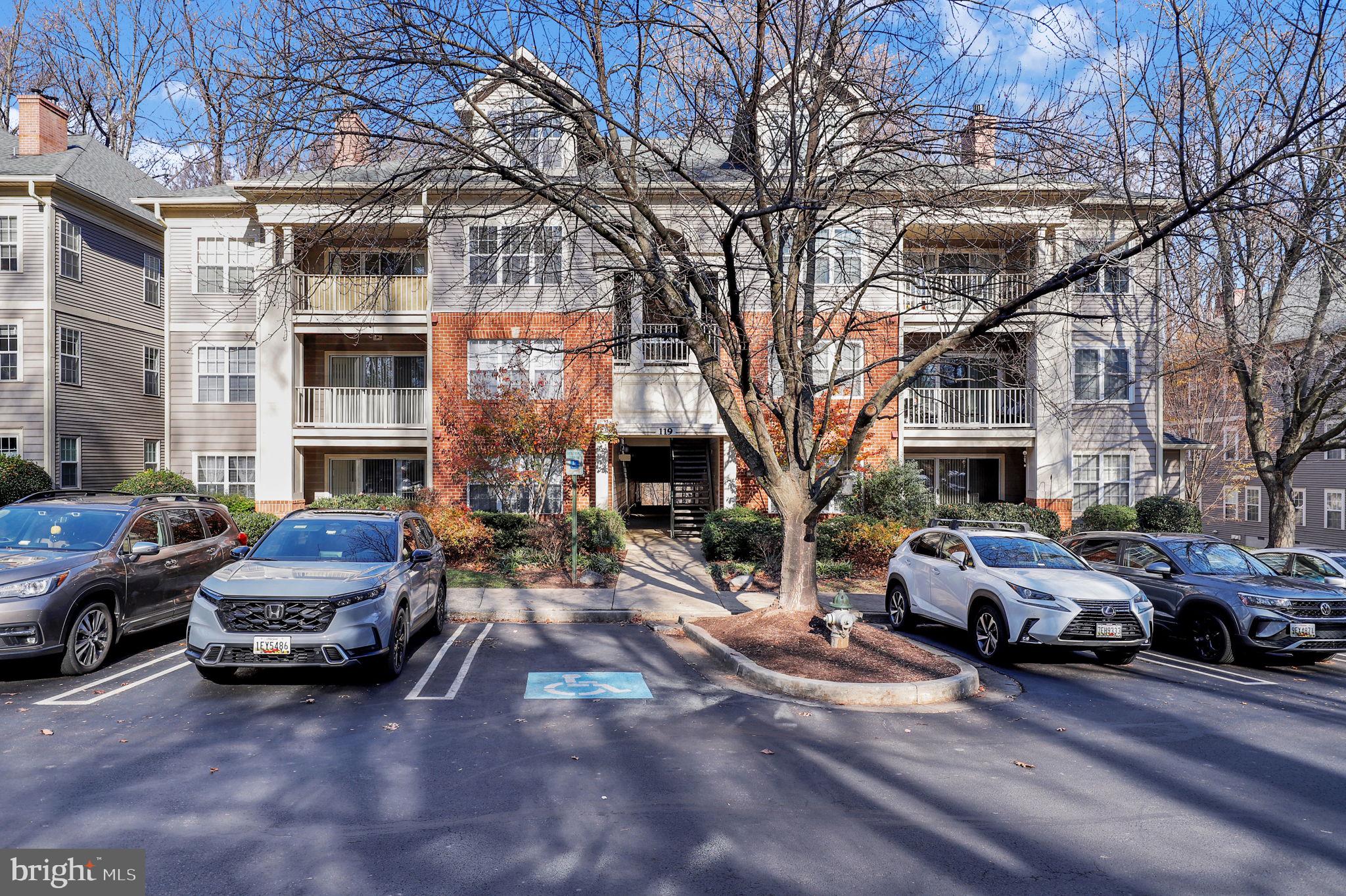 a car parked in front of a brick building