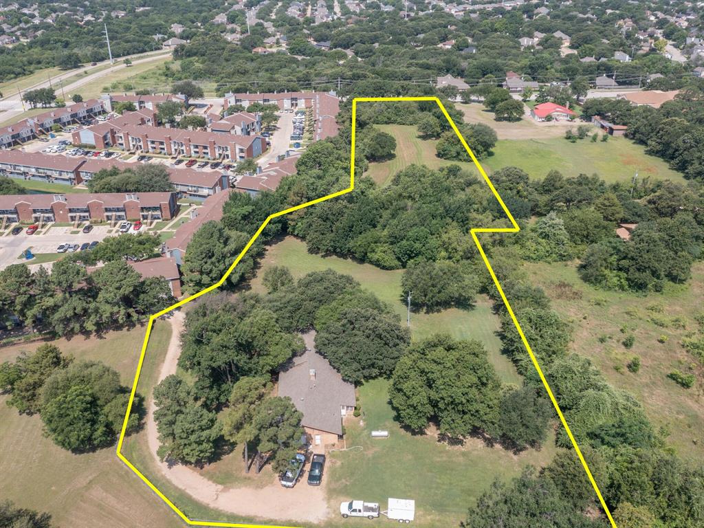 an aerial view of residential house with outdoor space