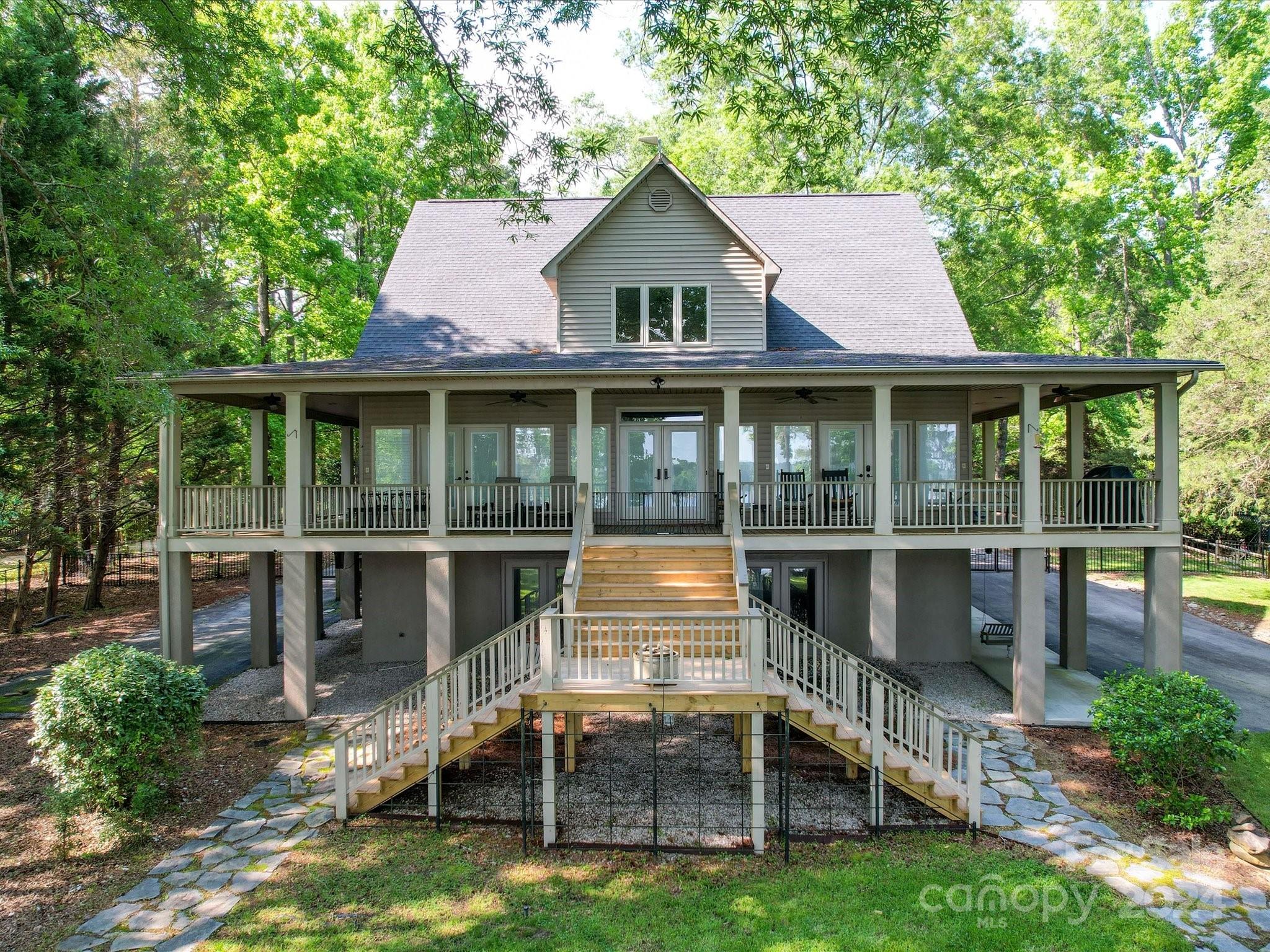 a front view of a house with a yard and balcony