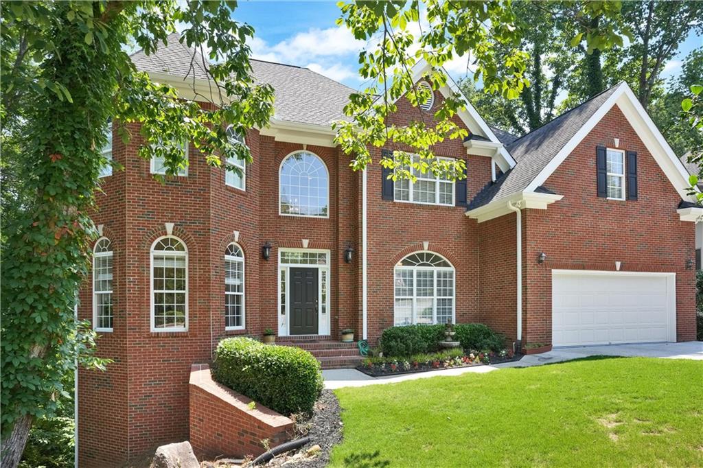 front view of a house with a yard