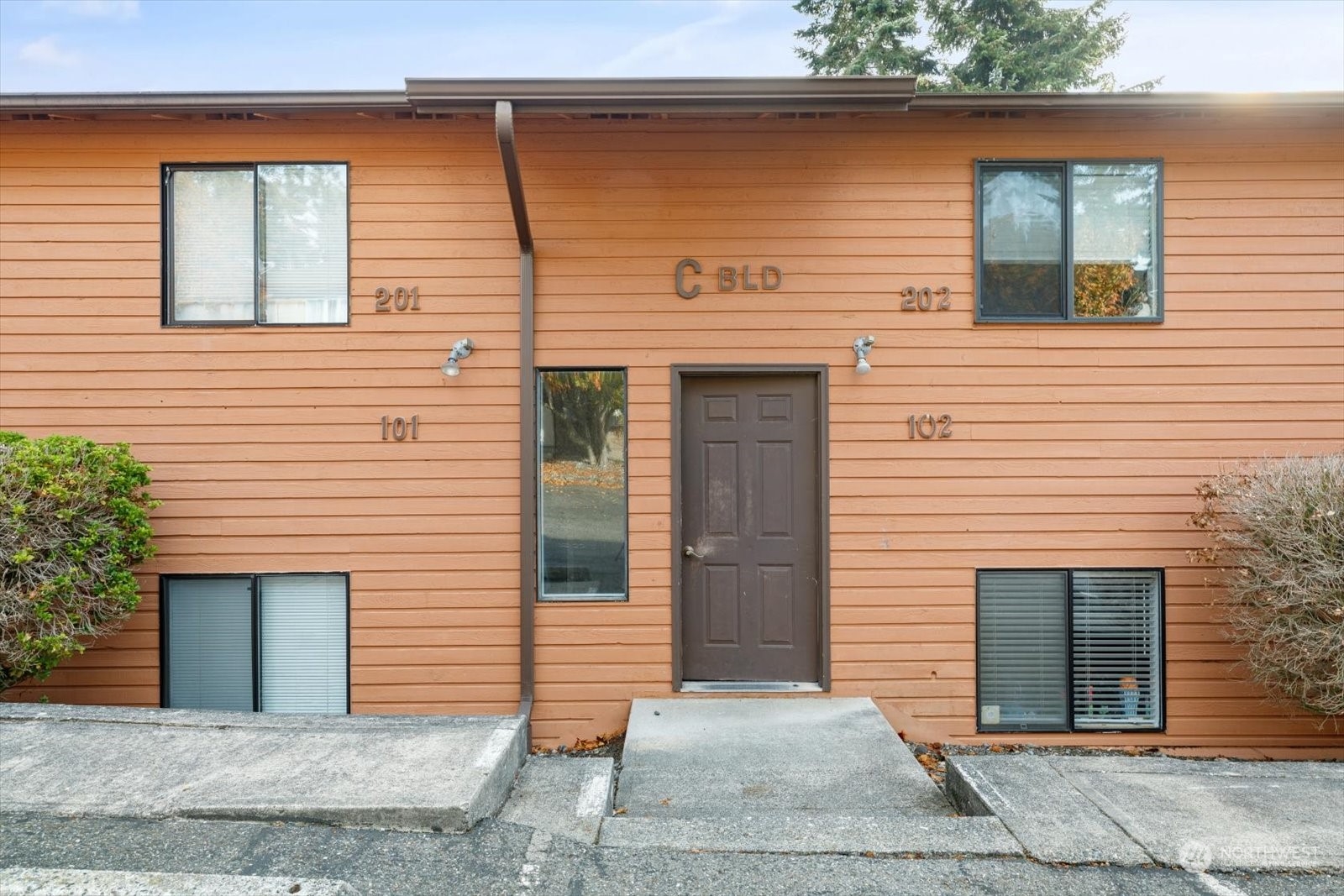 a front view of a house with garage