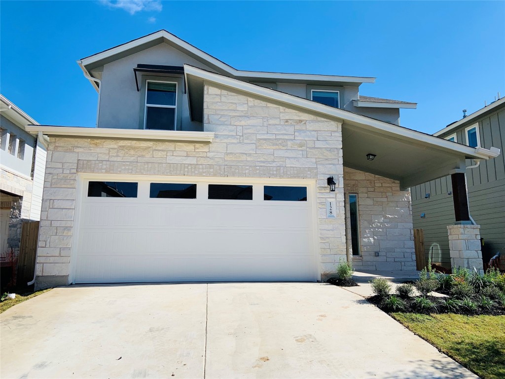 a front view of a house with yard