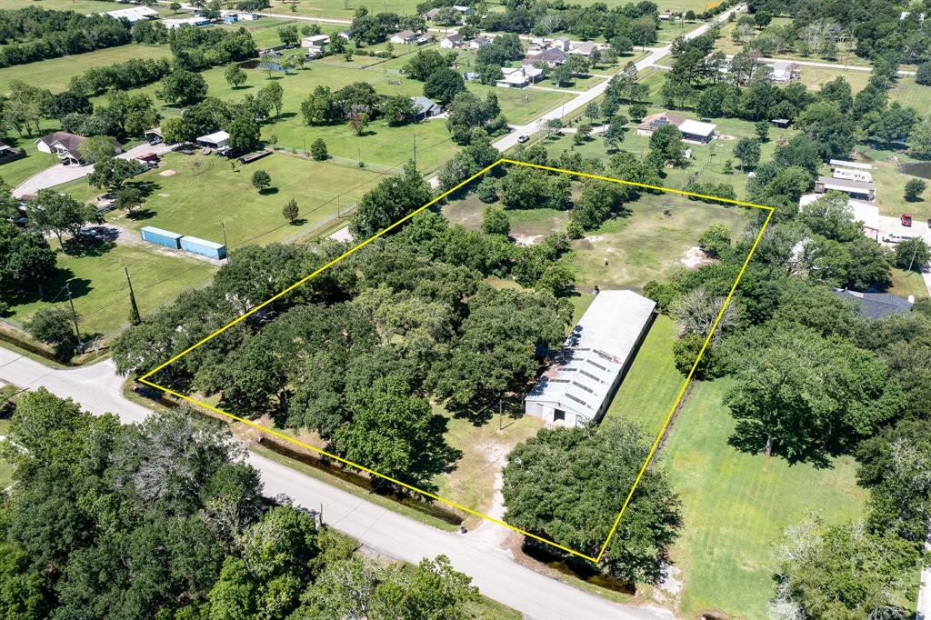 an aerial view of a residential houses with outdoor space