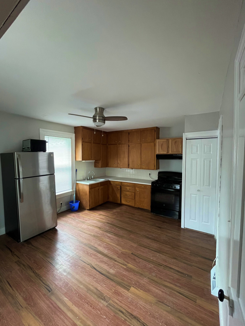 a kitchen with stainless steel appliances a refrigerator and a sink