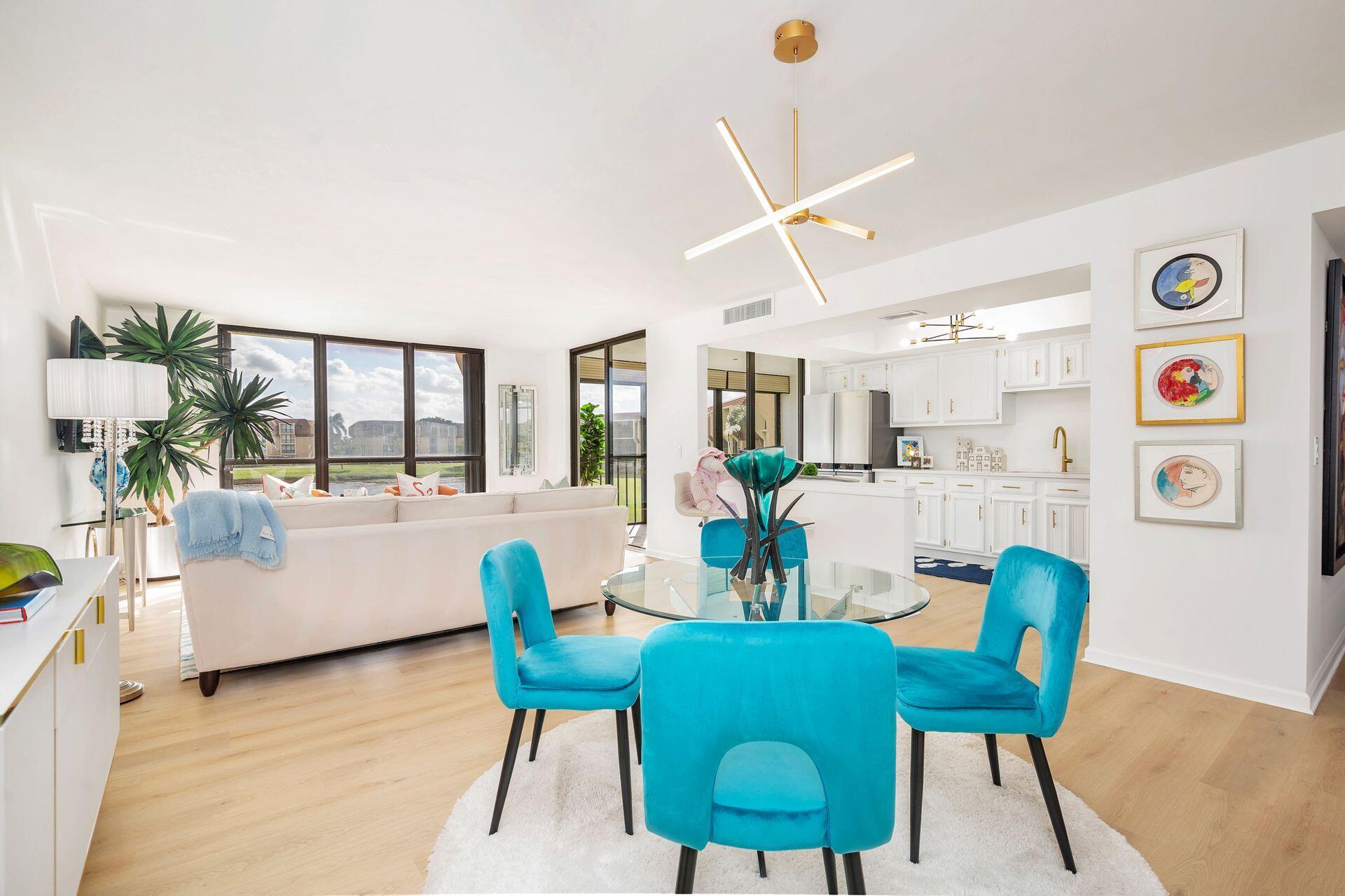 a dining room with furniture and wooden floor