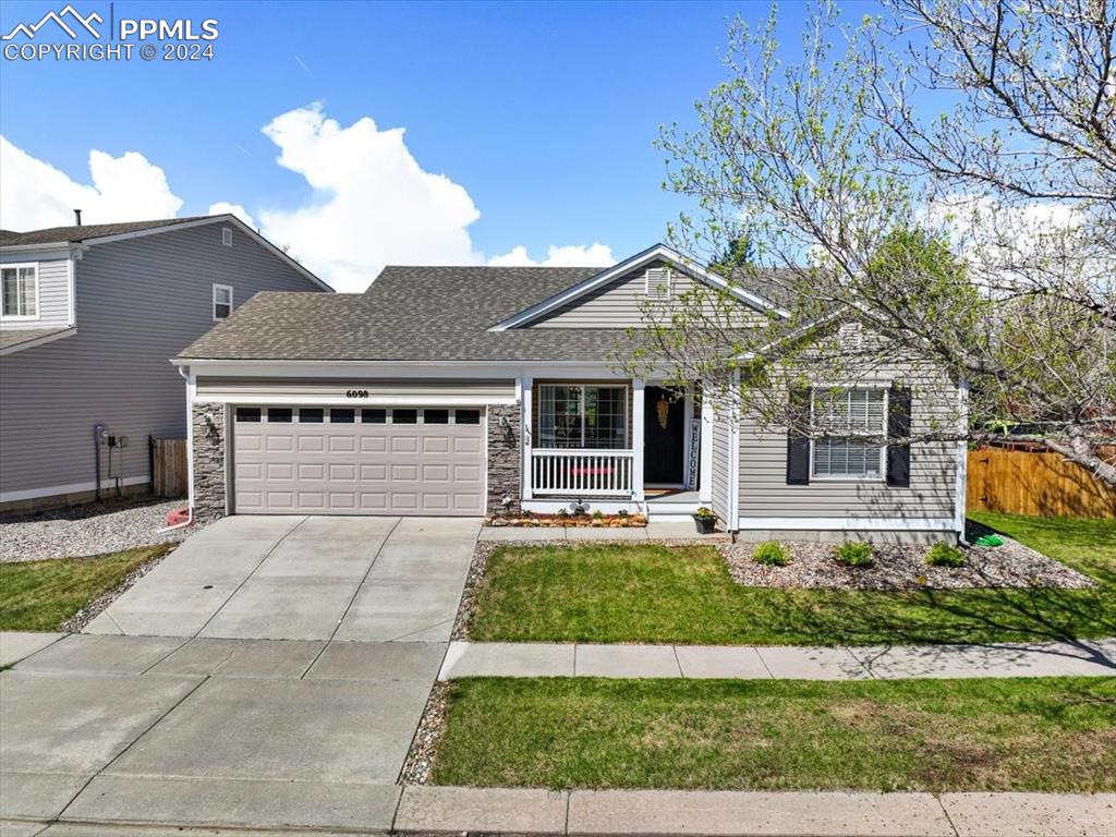 front view of a house with a yard