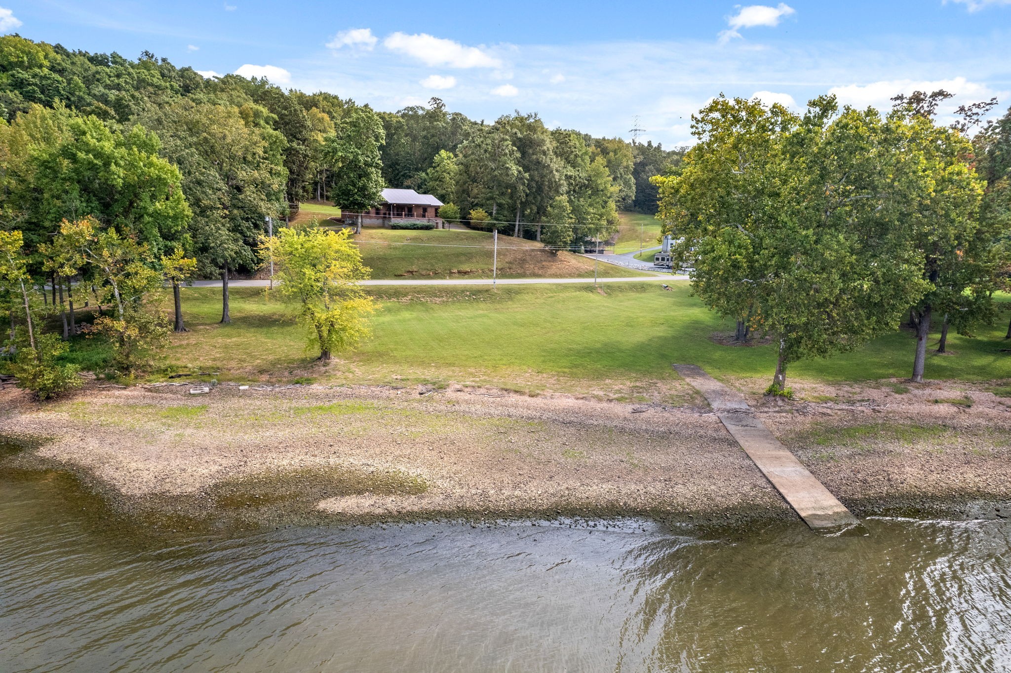 a view of a swimming pool with a yard