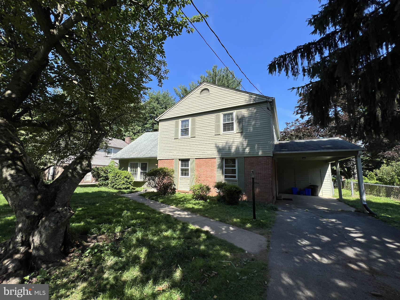 a view of house with yard