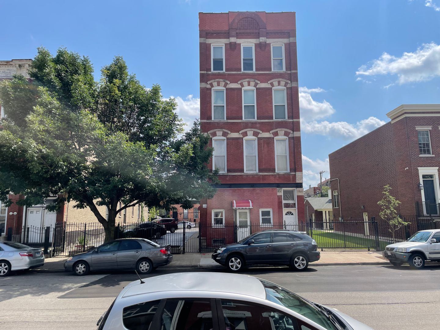 a car parked in front of a buildings