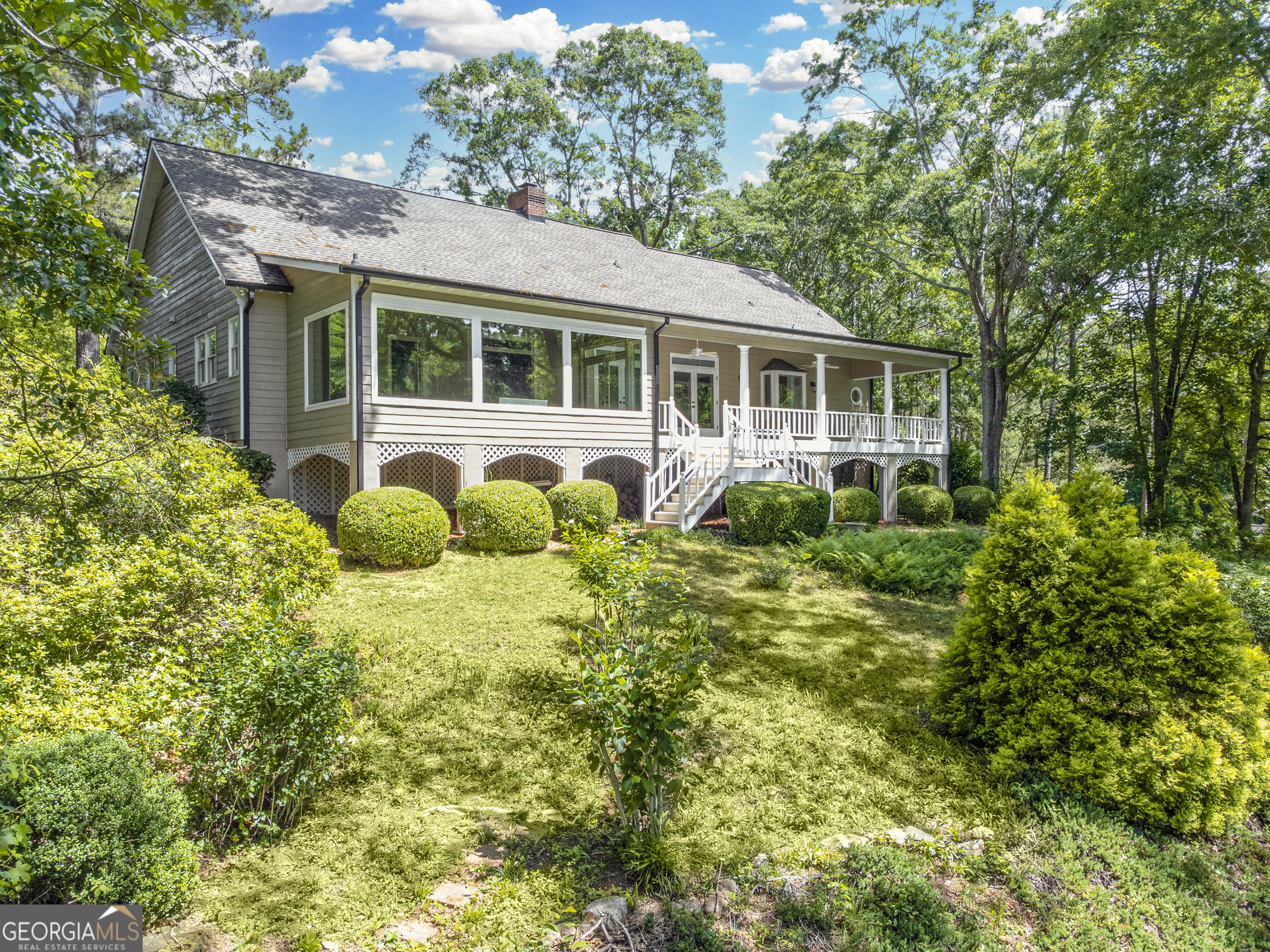 a house view with a garden space