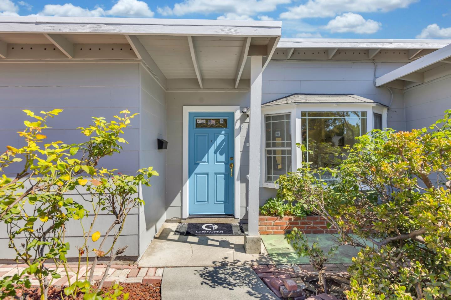 a front view of a house with an outdoor space