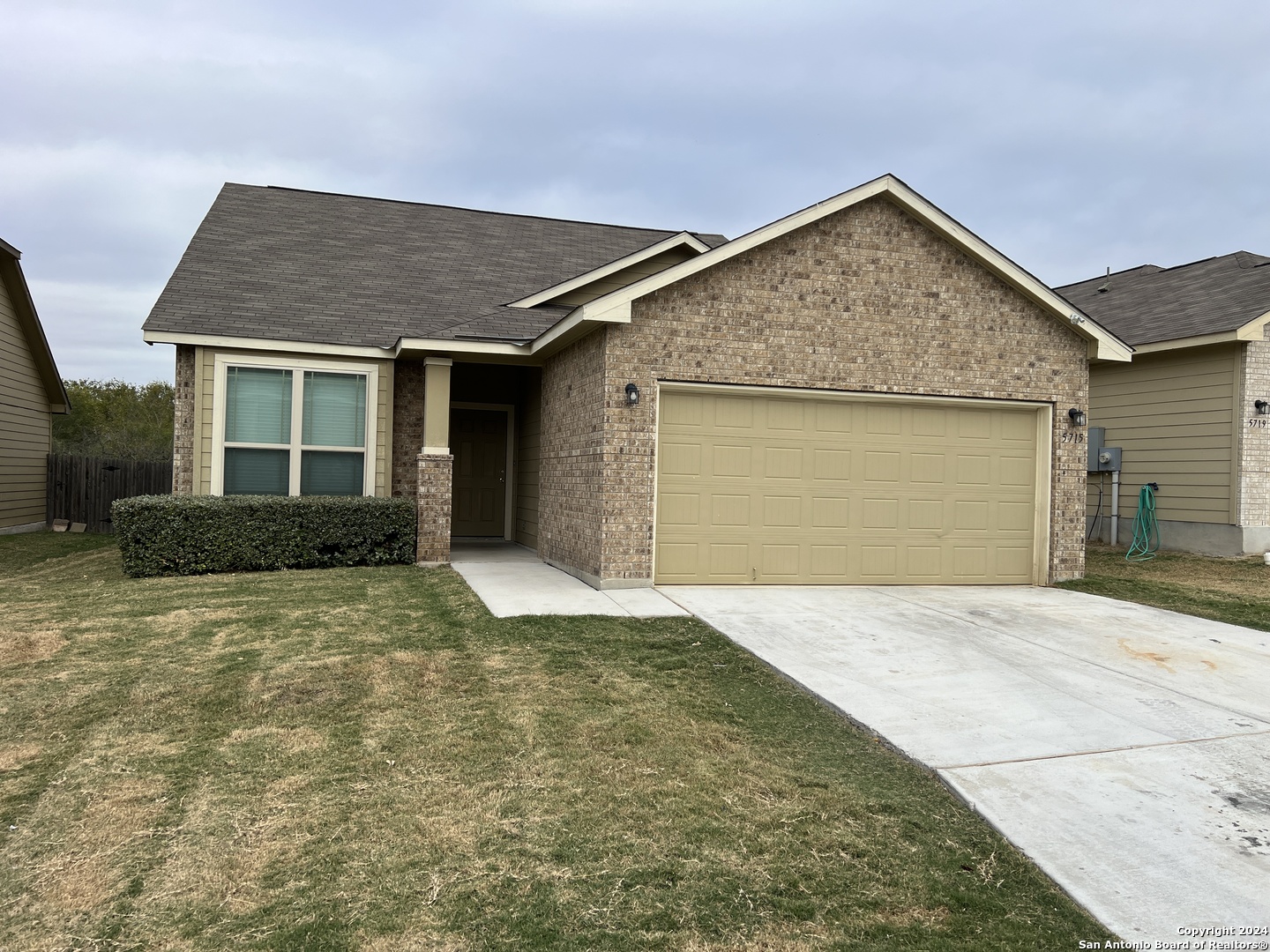 front view of a house and a yard