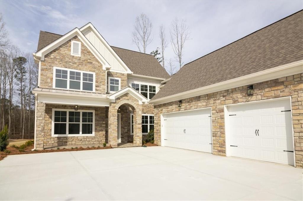 a front view of a house with a garage