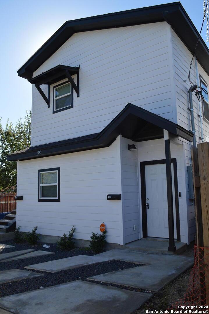 a front view of a house with garage