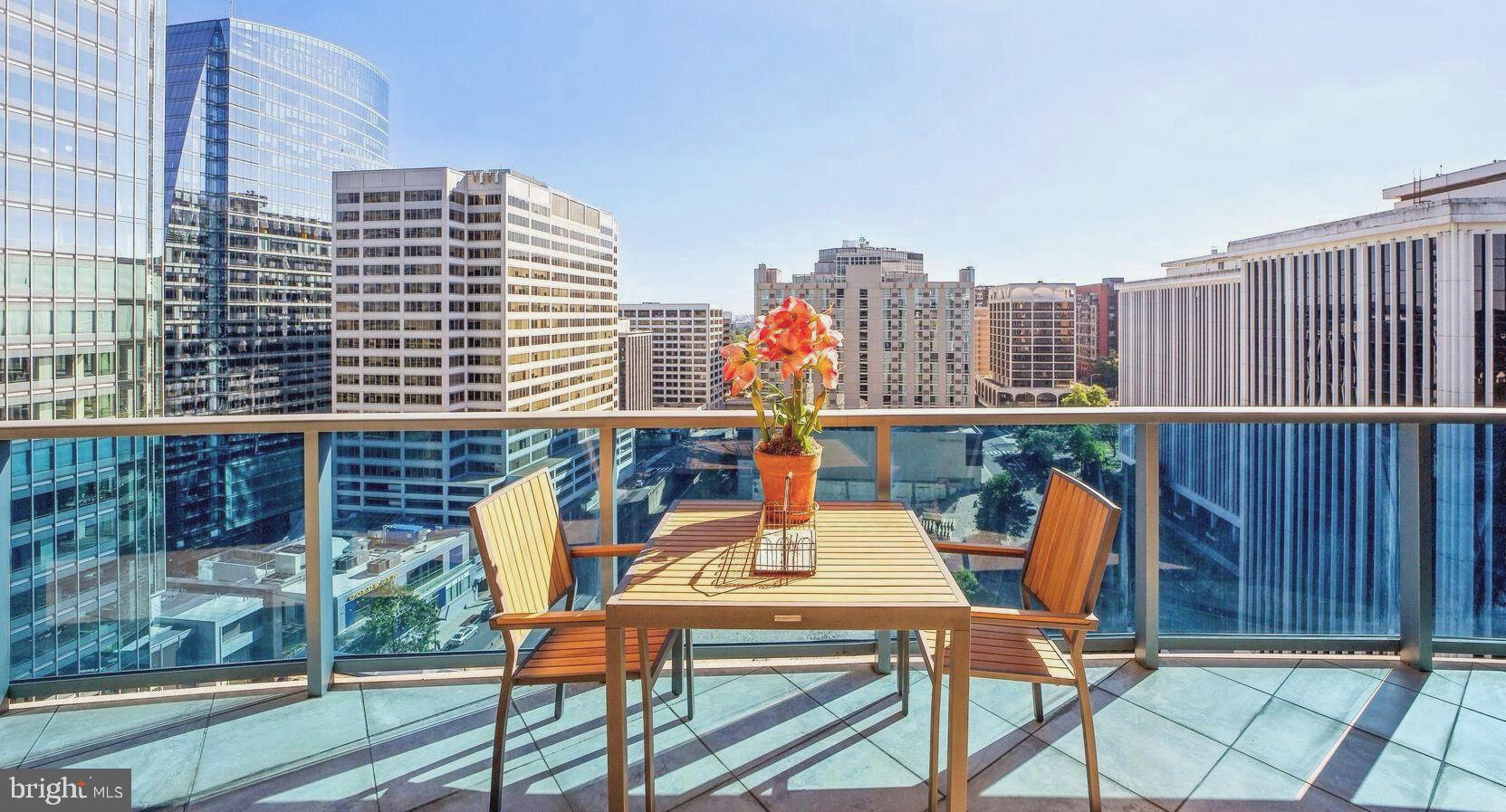 a view of balcony with outdoor seating and city view