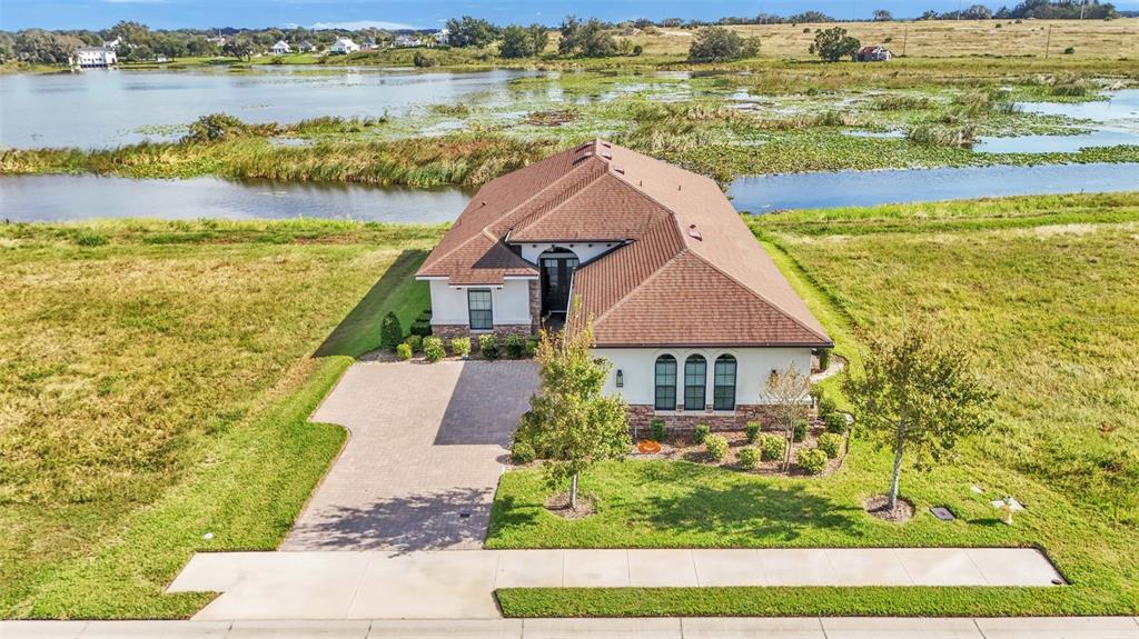 a aerial view of a house with a lake view