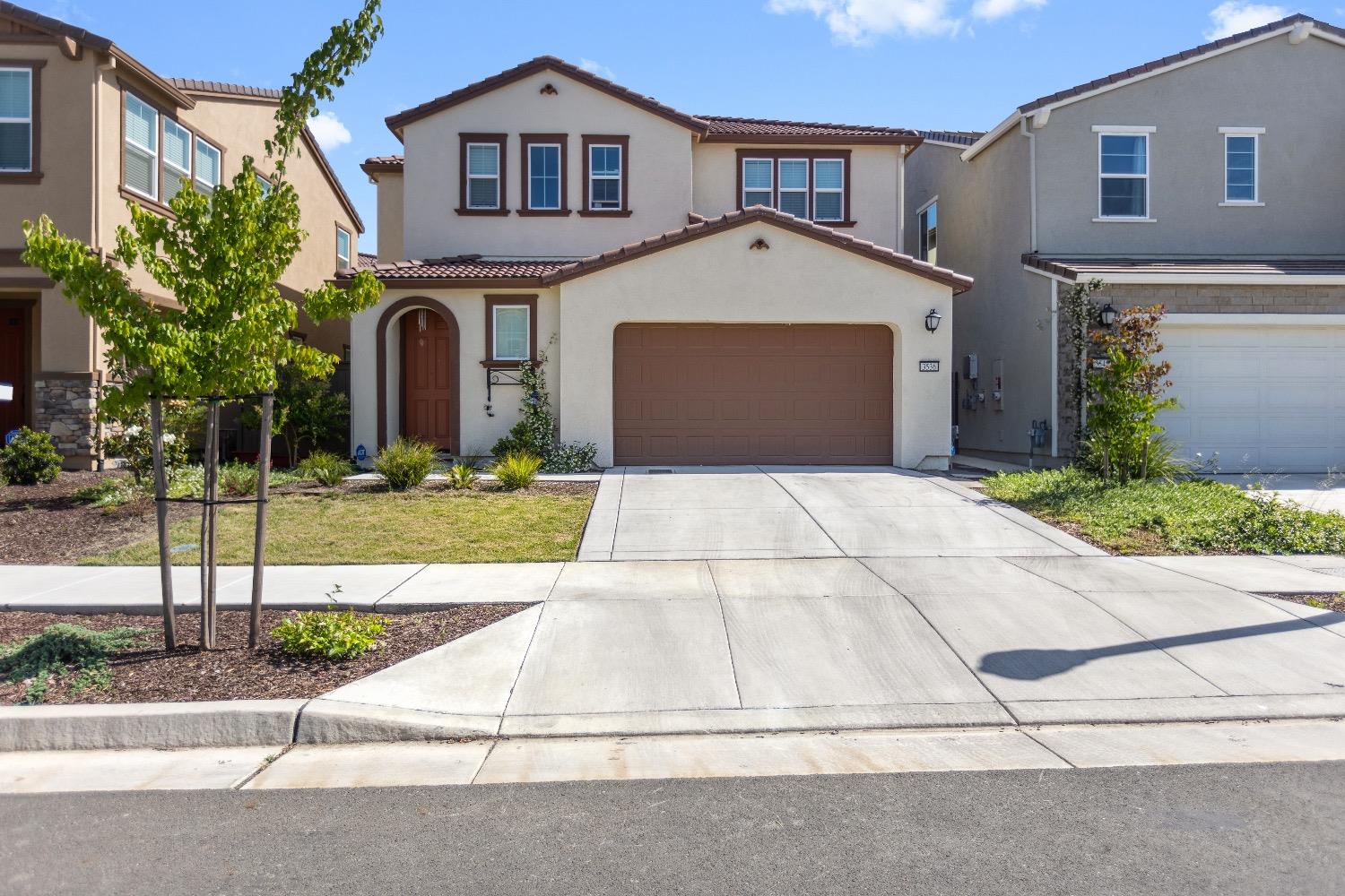 a front view of a house with yard