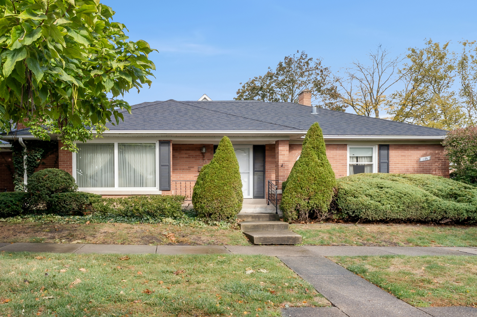 front view of a house with a yard