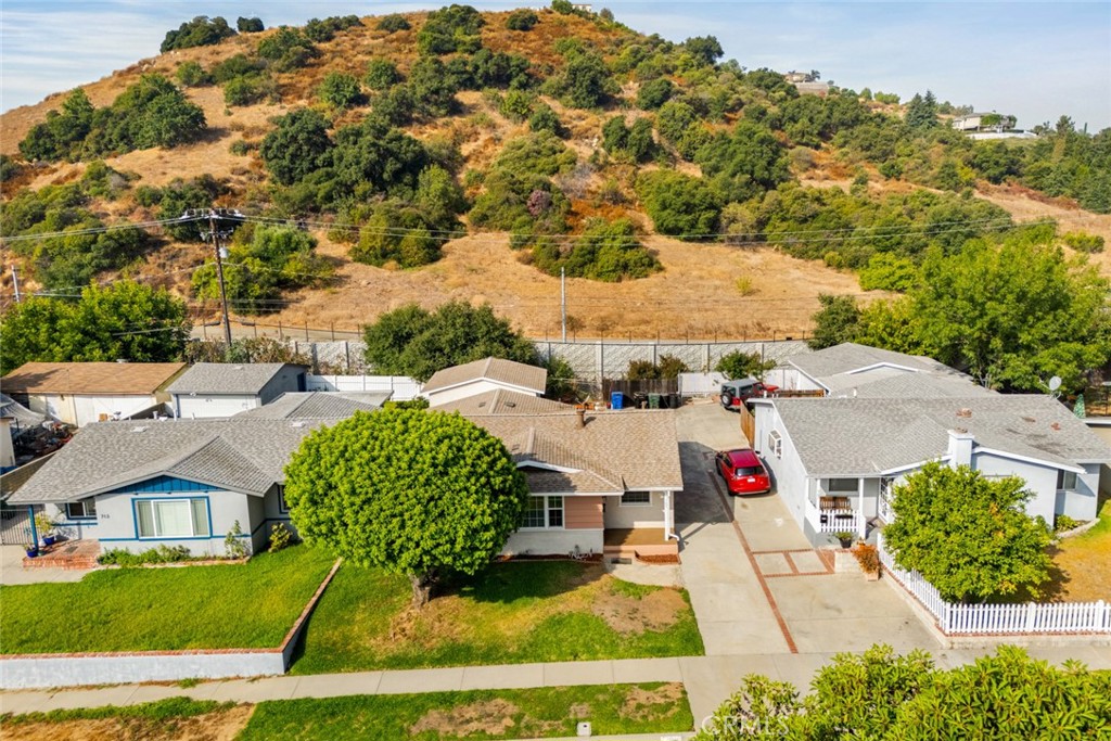 an aerial view of residential houses with outdoor space