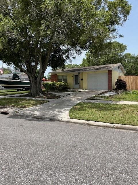 a view of a house with a yard