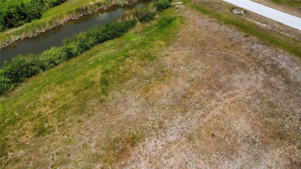 a view of a lake with a yard