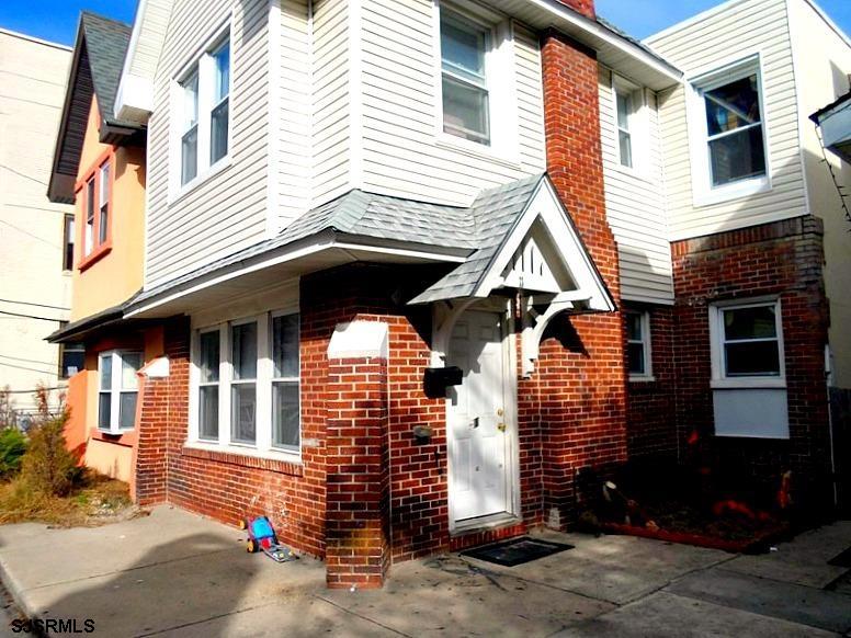 a front view of a house with parking