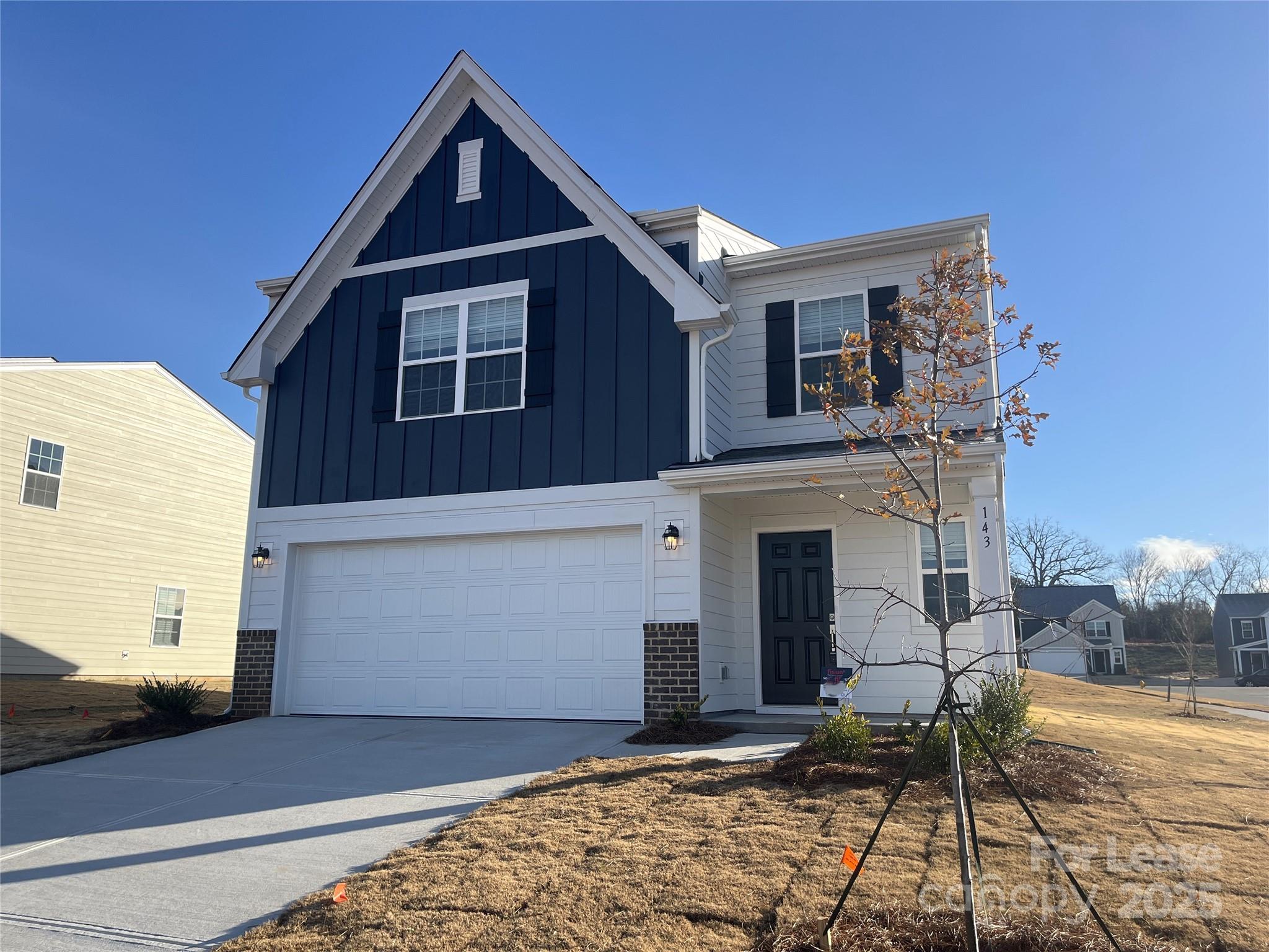 a front view of a house with yard