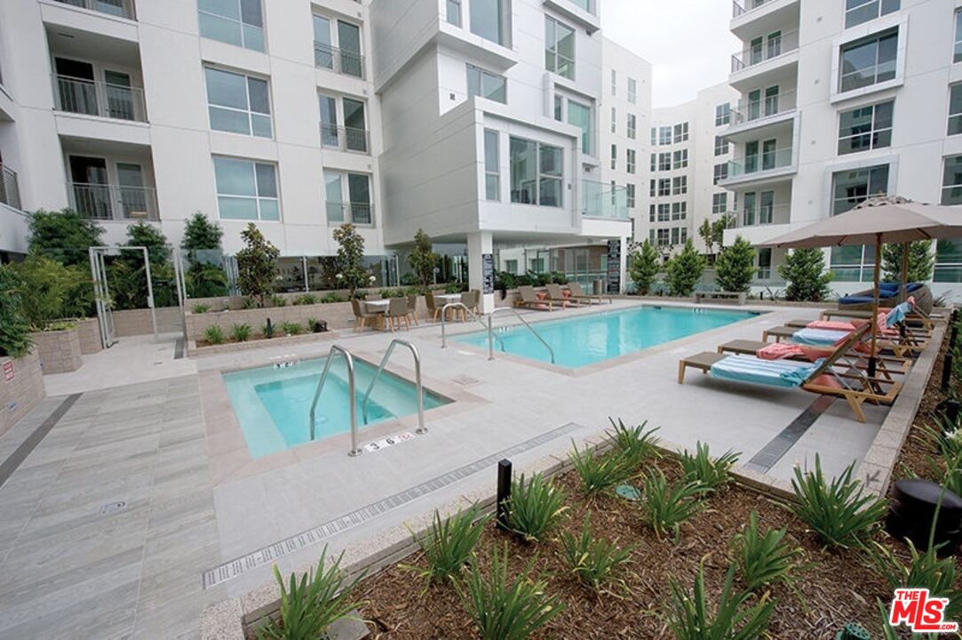 a view of a swimming pool with a lounge chairs