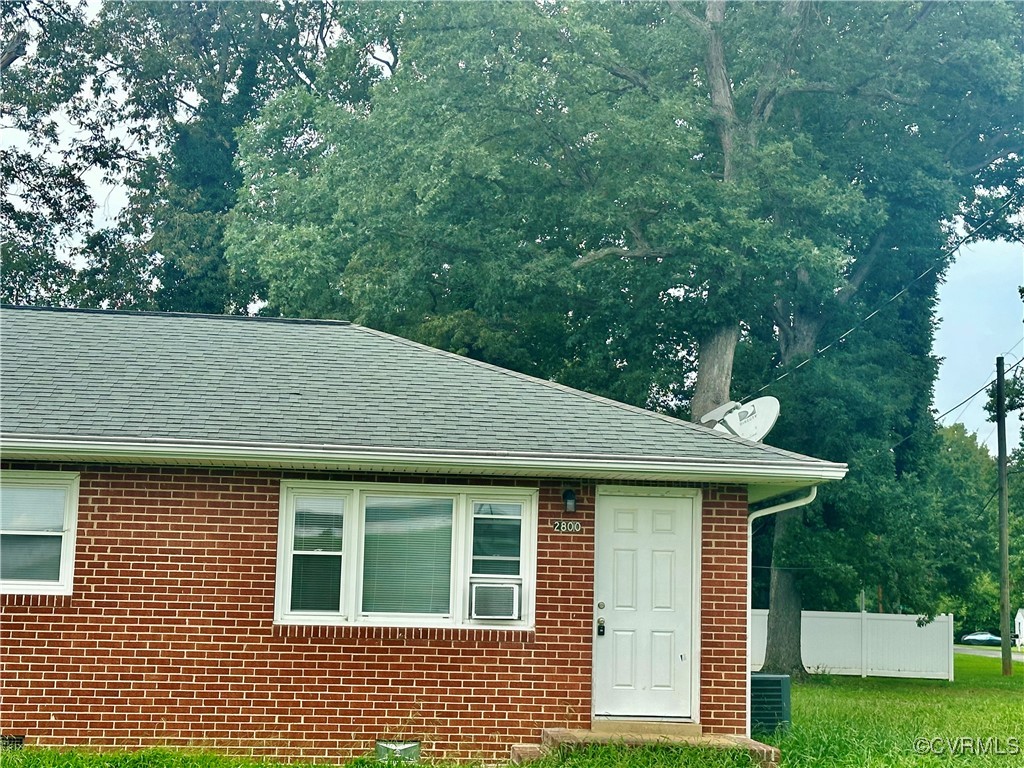 a aerial view of a house with a yard