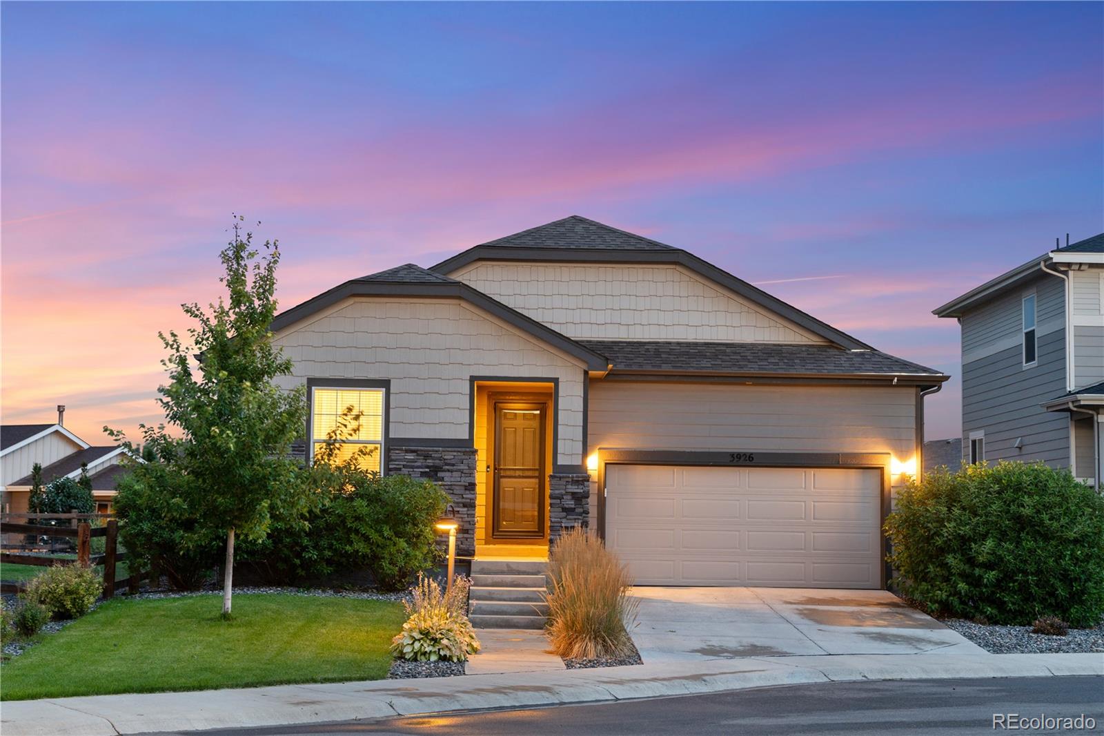 a front view of a house with yard