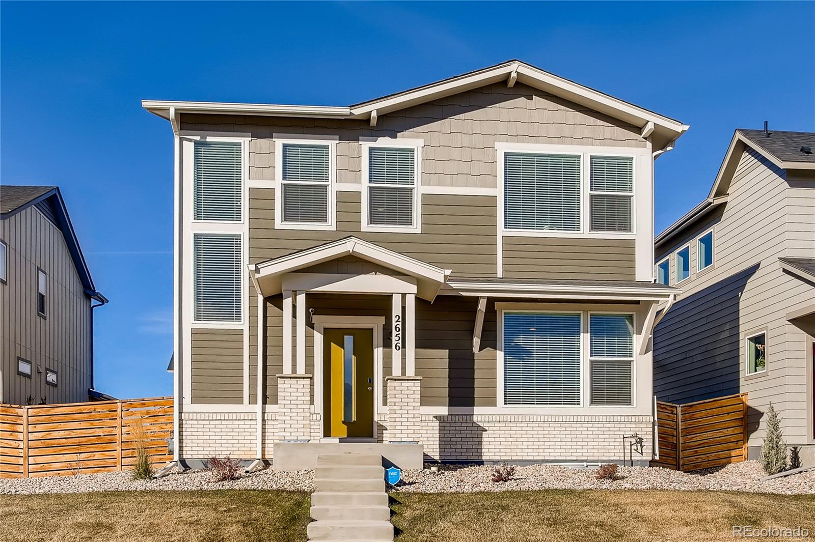 a front view of a house with garage