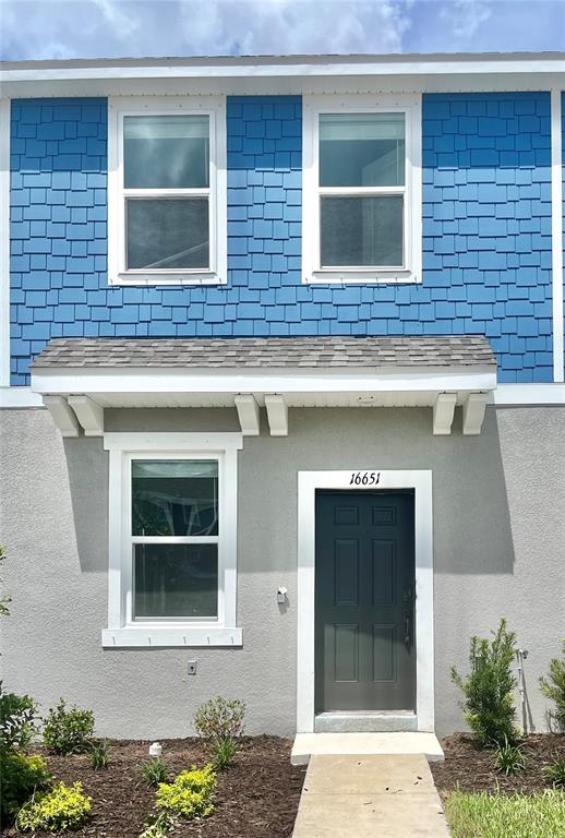 a front view of a house with windows