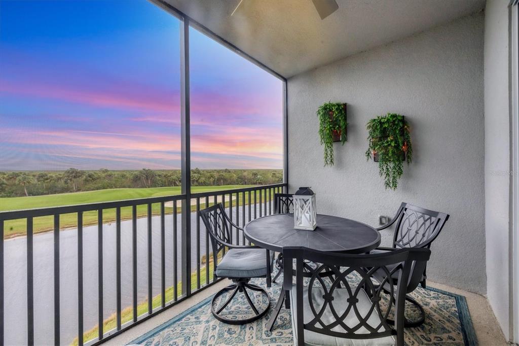 a view of a balcony with a table and chairs