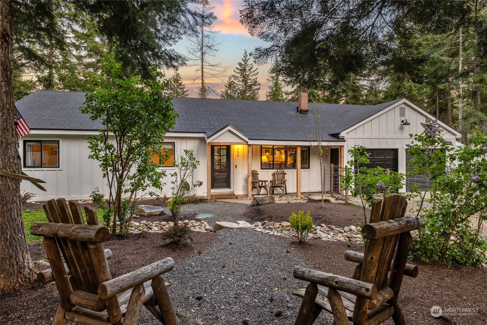 a view of a house with backyard sitting area and garden