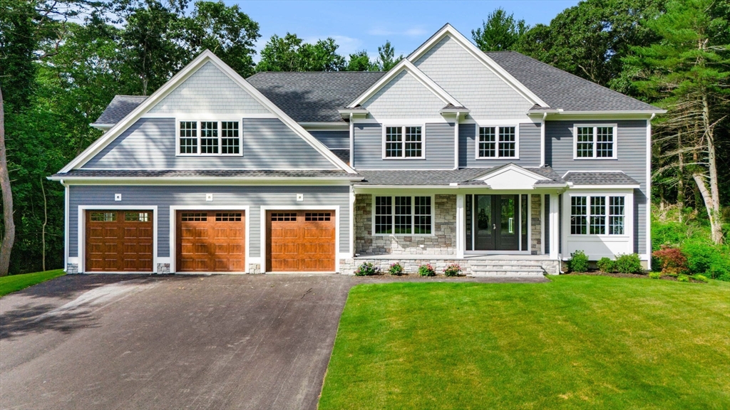 front view of a house with a yard