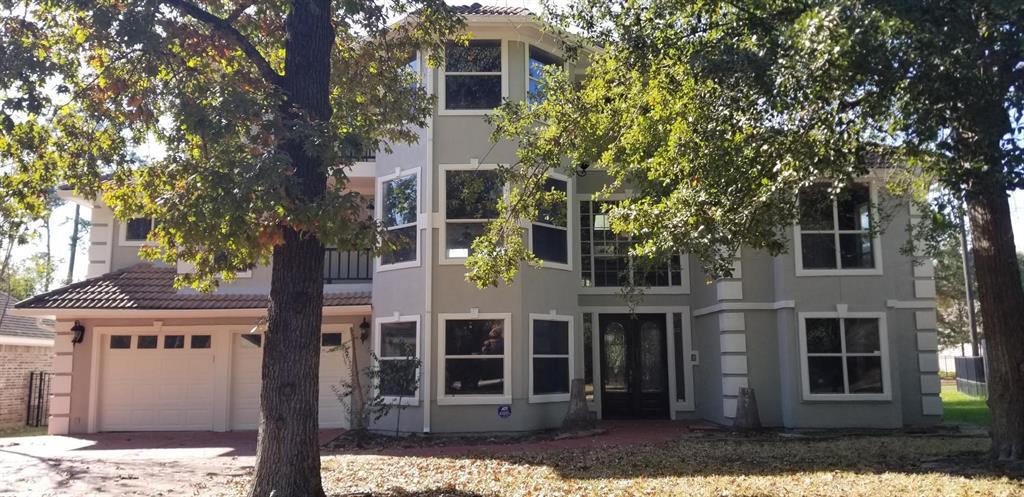 a view of a house with a tree