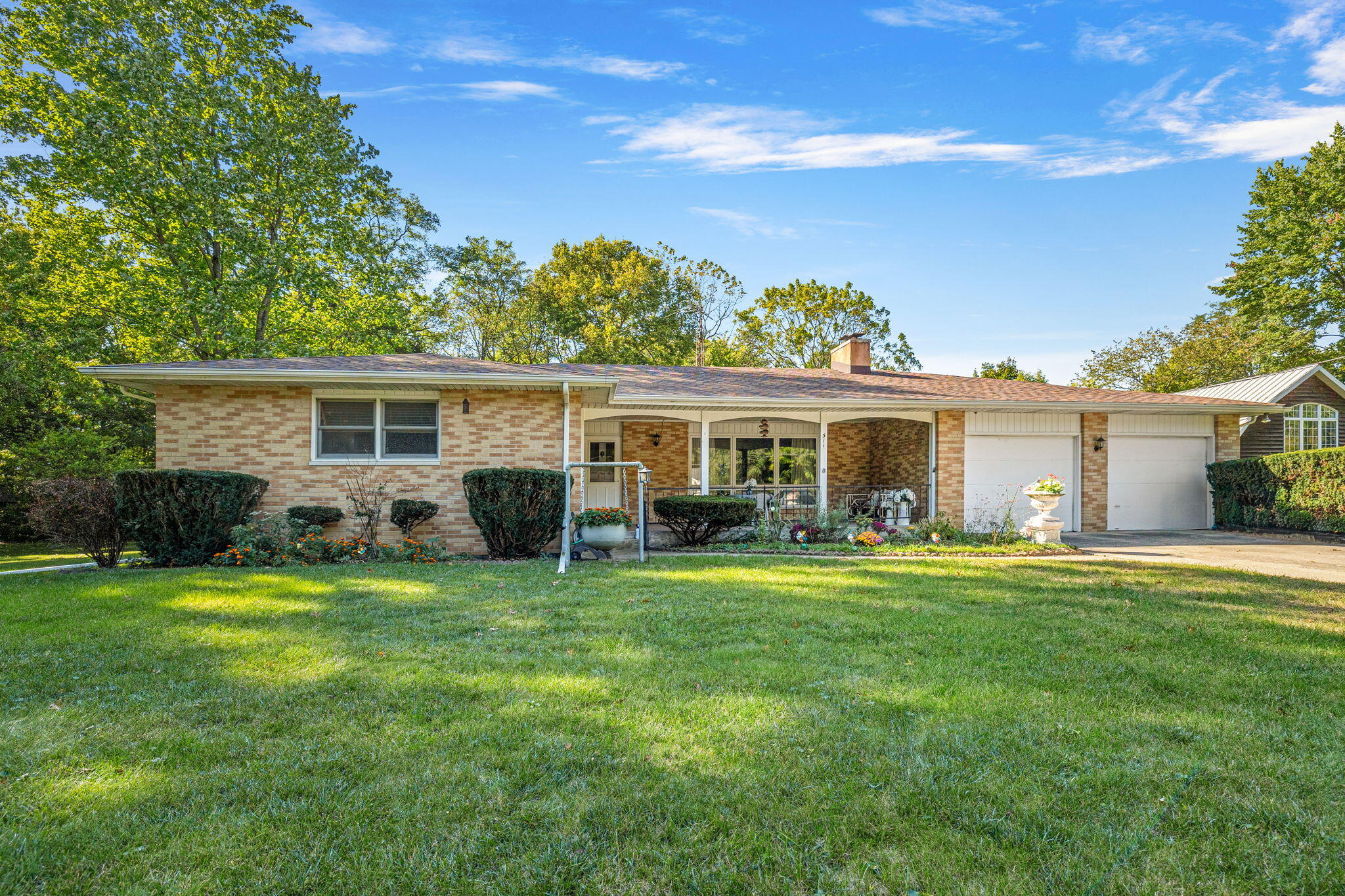 front view of a house with a garden