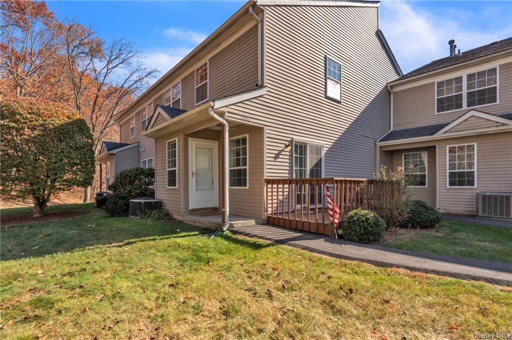 a view of a house with a yard and plants