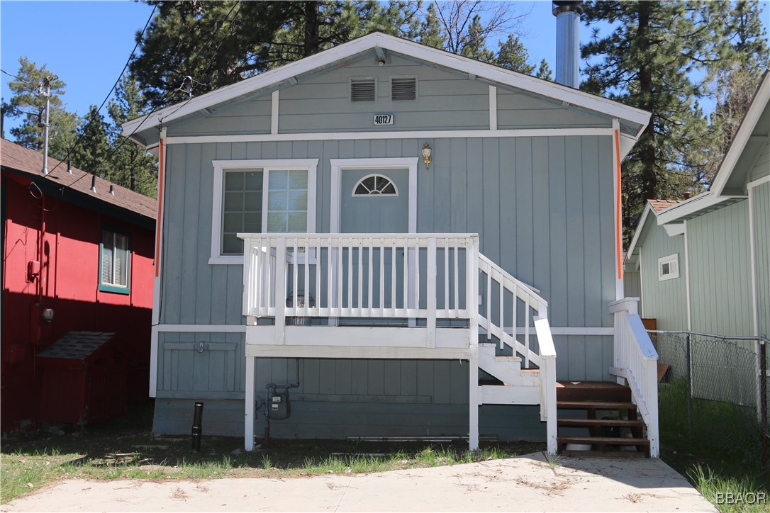 a front view of a house with stairs