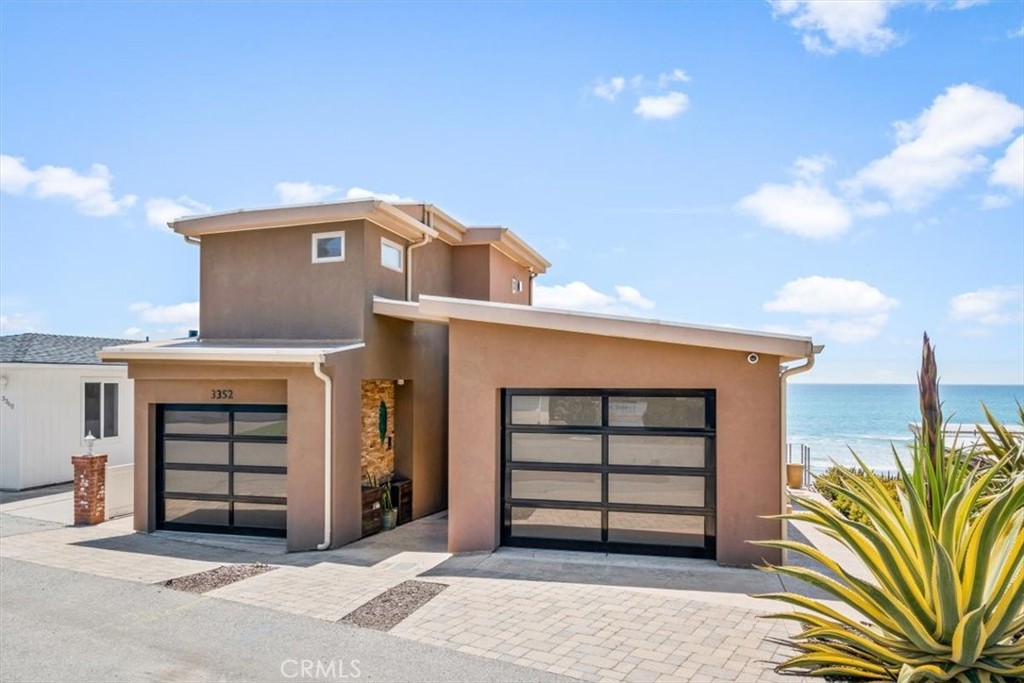 a front view of a house with a garage