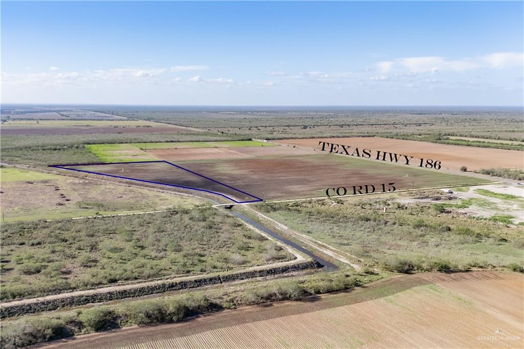 Birds eye view of property featuring a rural view