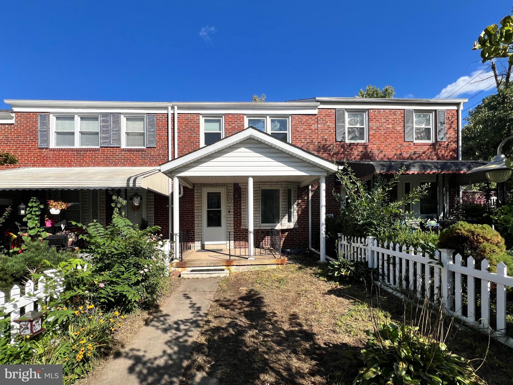 a front view of a house with a porch