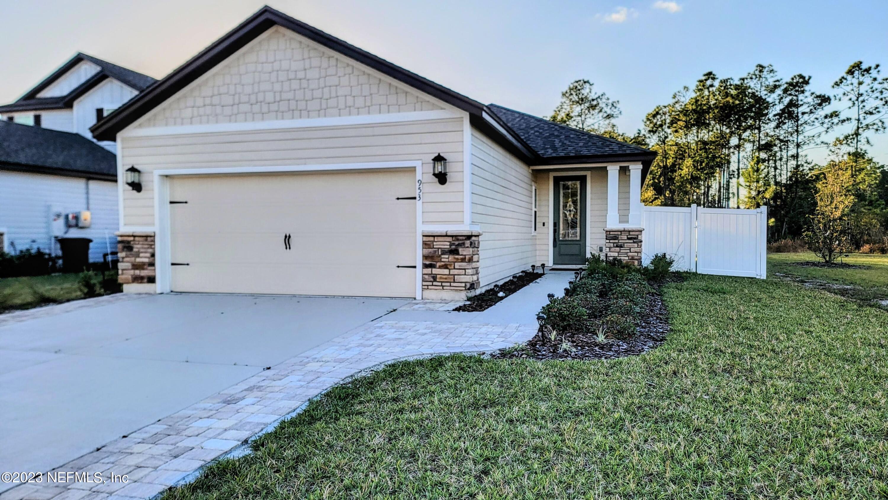 a front view of house with yard and outdoor seating