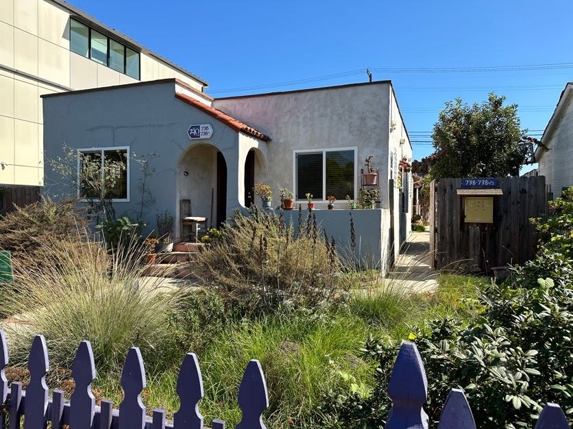 a front view of house with yard and seating space