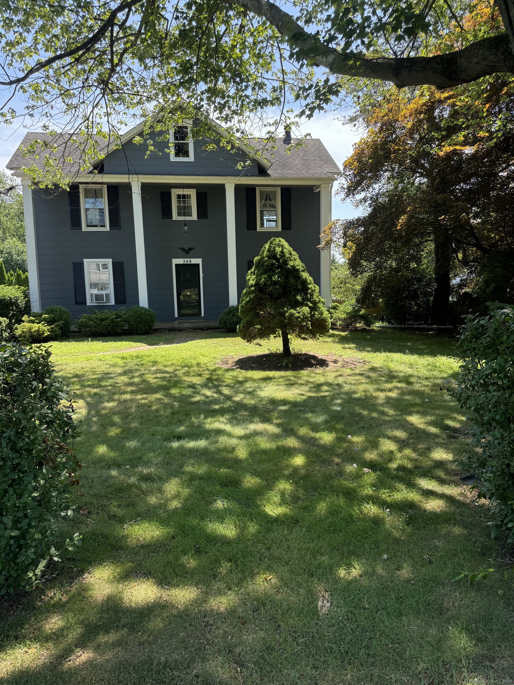 a house view with a garden space